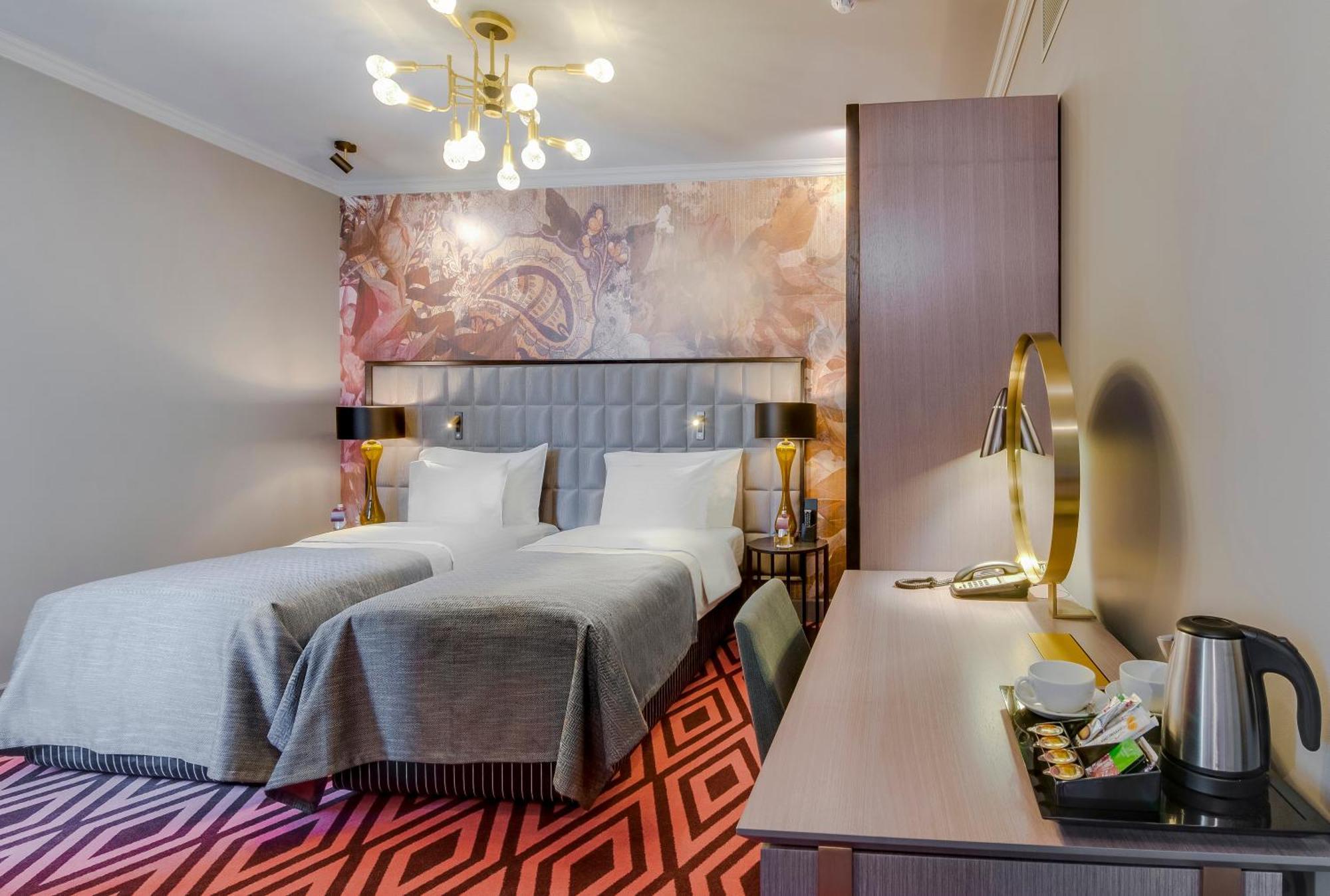 Grand Poet Hotel And Spa By Semarah Рига Екстериор снимка A room at the hotel